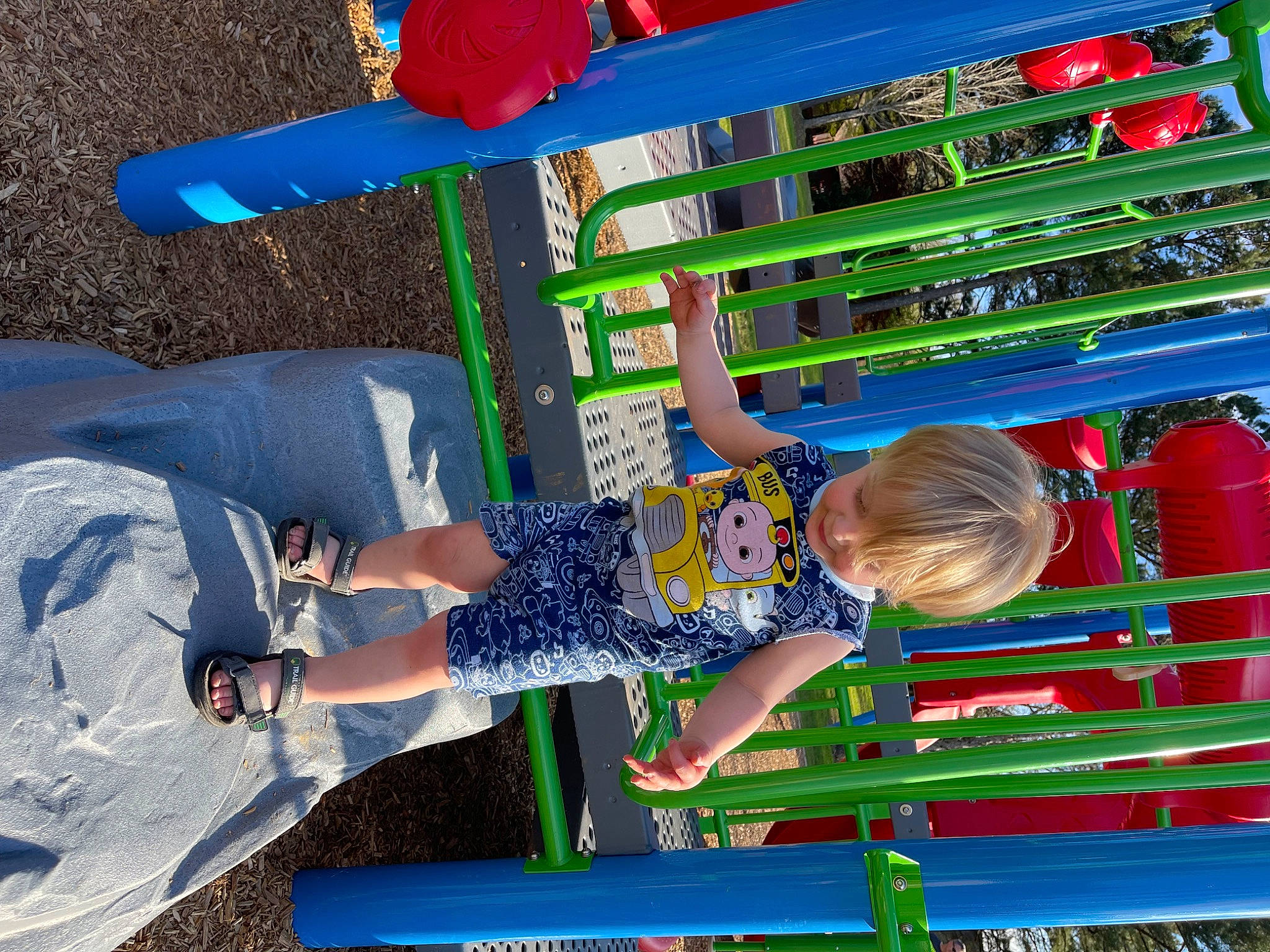 Matthew is registered to the contest to win money with this photo: baby, baby_toddler_clothing, blue, child, city, electric_blue, fun, green, human_leg, leisure, person, play, recreation, red, shorts, t_shirt, thigh, toddler, toy, walking_shoe