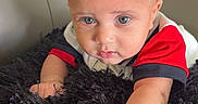 Cesar joined the competition — help win amazing prizes! baby, infant, child, blue_eyes, curious, fluffy_rug, black_rug, couch, gray_couch, indoor, portrait, cute, small_hand, short_hair, red_shirt, white_shirt, toddler, face, looking, home