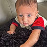 baby, infant, child, blue_eyes, curious, fluffy_rug, black_rug, couch, gray_couch, indoor, portrait, cute, small_hand, short_hair, red_shirt, white_shirt, toddler, face, looking, home
