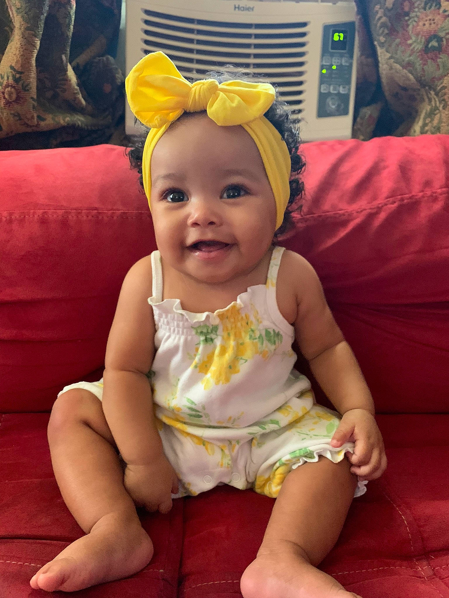 Londyn joined the competition — help win amazing prizes! baby, baby_toddler_clothing, cap, cheek, child, costume_hat, couch, fashion_accessory, fun, happy, headband, headpiece, joy, person, pink, sitting, skin, sleeve, smile, t_shirt