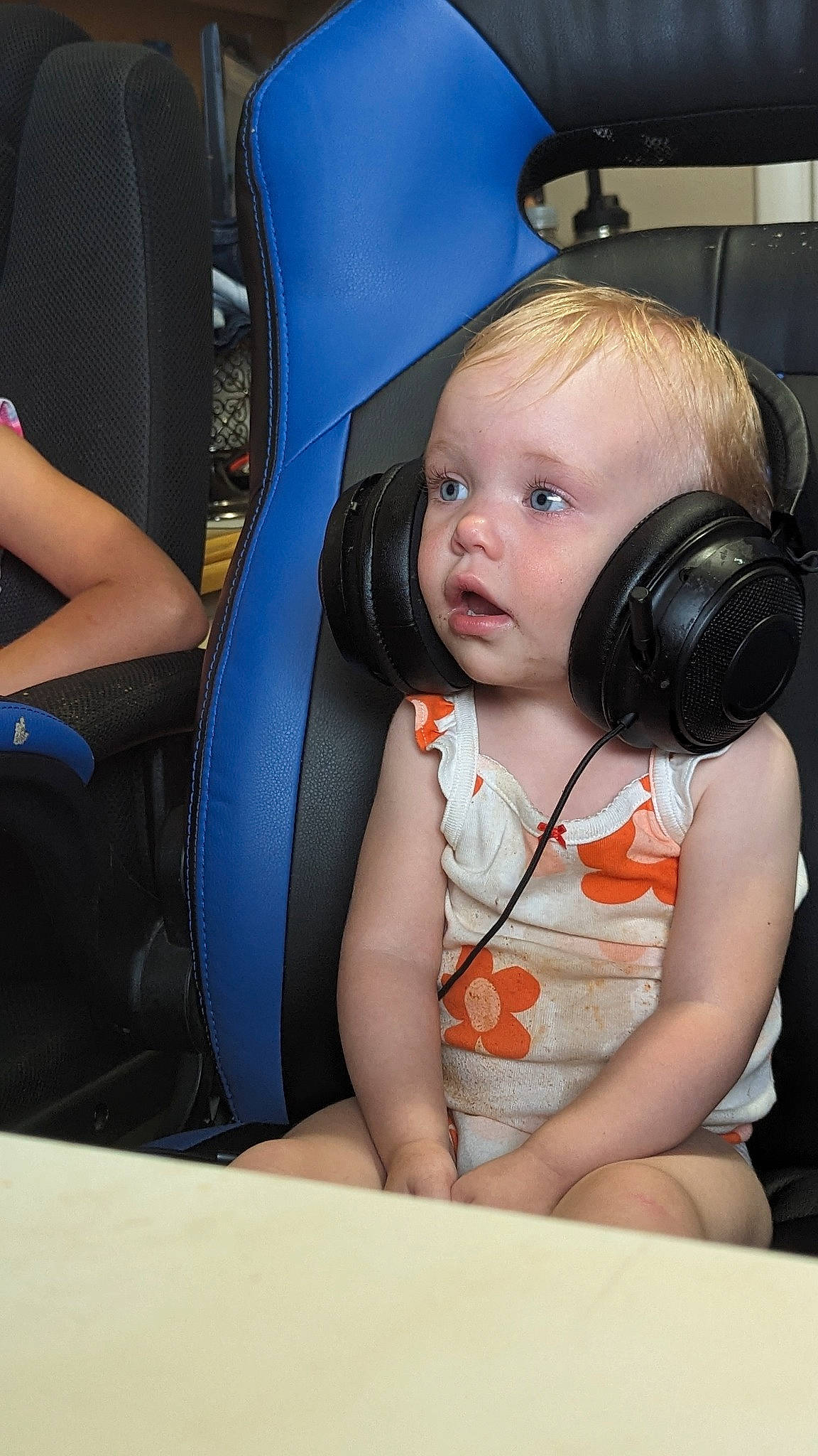 Evie is registered to the contest to win money with this photo: audio_equipment, auto_part, automotive_design, baby, car_seat, child, comfort, electronic_device, flash_photography, fun, happy, head_restraint, headphones, hearing, peripheral, person, sitting, skin, technology, toddler