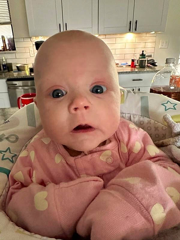 Elean is registered to the contest to win money with this photo: baby, baby_products, baby_safety, baby_toddler_clothing, cheek, child, comfort, eye, happy, iris, linens, lip, mouth, nail, nose, person, room, sitting, skin, thumb