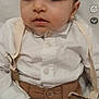 Jean-Joseph participe au concours pour gagner de l'argent avec cette photo : baby, infant, child, closeup, portrait, white_shirt, suspenders, brown_pants, big_eyes, cute, hand, buttons, indoors, blanket, laying_down, fashion, gaze, soft_lighting, mobile_ui, snapchat_overlay