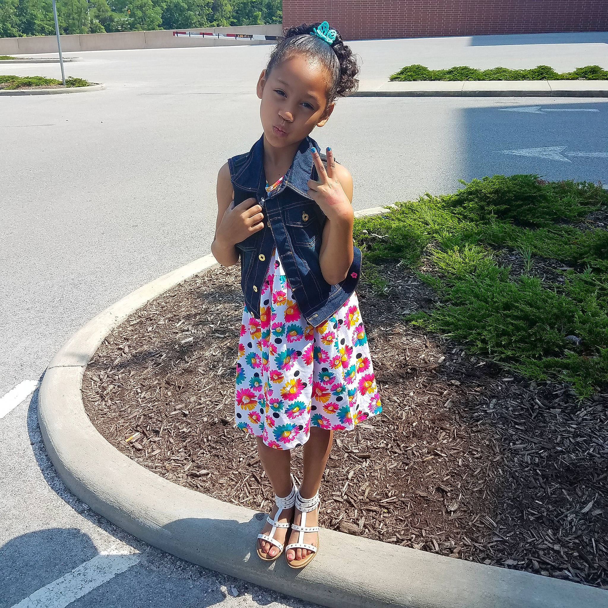 Surriah is registered to the contest to win money with this photo: child, clothing, design, fun, girl, jeans, pattern, person, plaid, plant, play, recreation, shoe, shorts, shoulder, summer, vacation