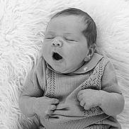 Freddie joined the competition — help win amazing prizes! baby, black_and_white, blanket, child, cozy, cute, cute_expression, face, infant, knitwear, monochrome, newborn, peaceful, portrait, resting, sleepy, small_hands, soft, soft_texture, yawning