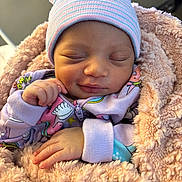 Rylynn joined the competition — help win amazing prizes! baby, newborn, infant, sleeping, smiling, blanket, hat, onesie, cozy, soft, cute, child, peaceful, portrait, indoors, warm, hand, face, closeup, resting