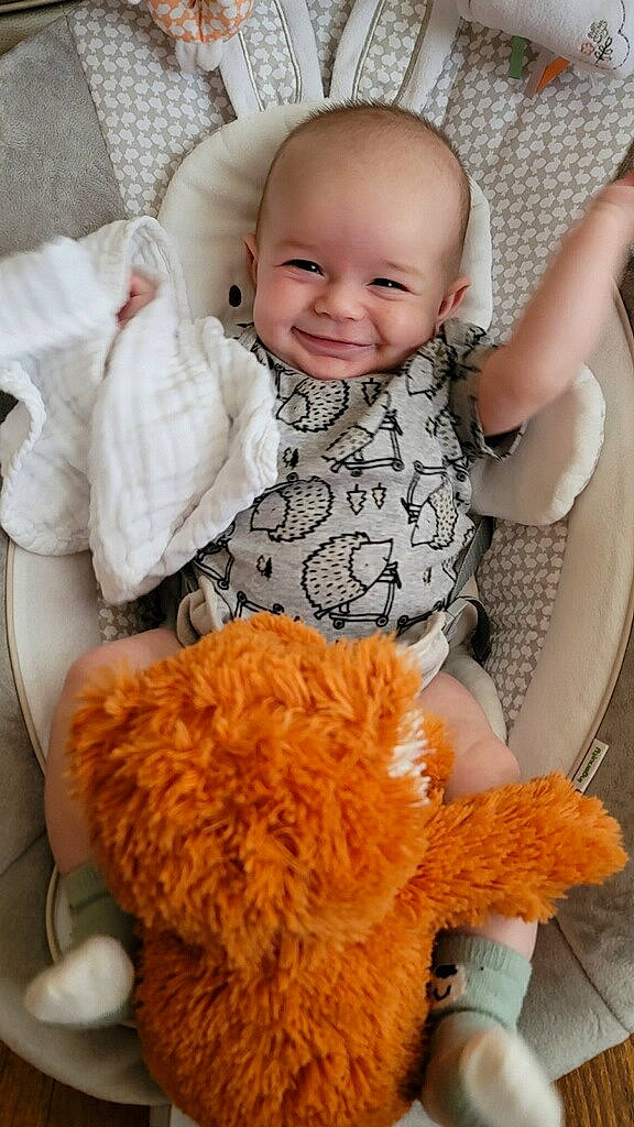 Carter joined the competition — help win amazing prizes! baby, baby_toddler_clothing, child, comfort, face, fun, happy, joy, orange, organ, person, photograph, skin, sleeve, smile, stuffed_toy, teddy_bear, textile, toddler, toy
