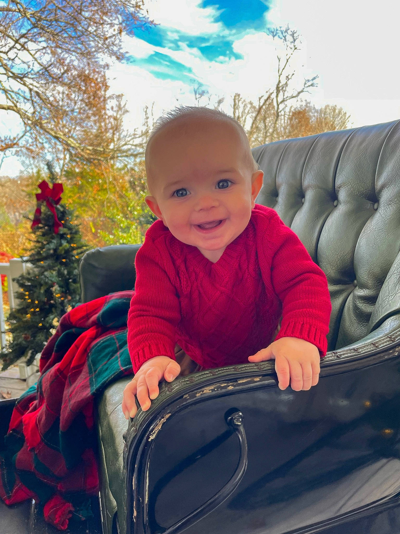 Carter is registered to the contest to win money with this photo: child, cloud, comfort, eye, facial_expression, fun, grass, hairstyle, happy, head, joy, lap, leaf, leisure, motor_vehicle, person, plant, sky, smile, toddler