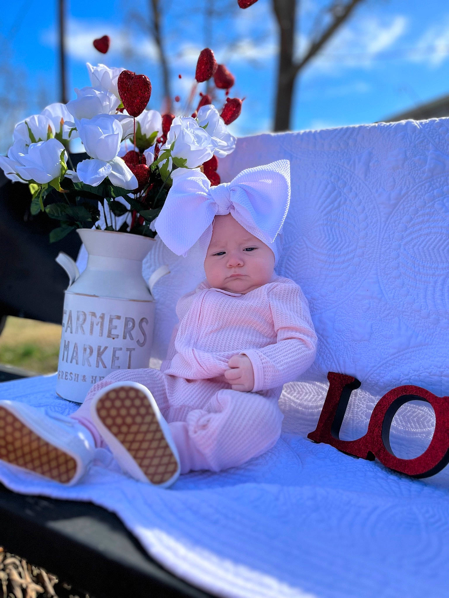 Kenleigh joined the competition — help win amazing prizes! baby, baby_toddler_clothing, cap, chair, child, event, flower, flower_arranging, grass, happy, hat, headgear, headwear, leisure, linens, person, petal, plant, recreation, sitting