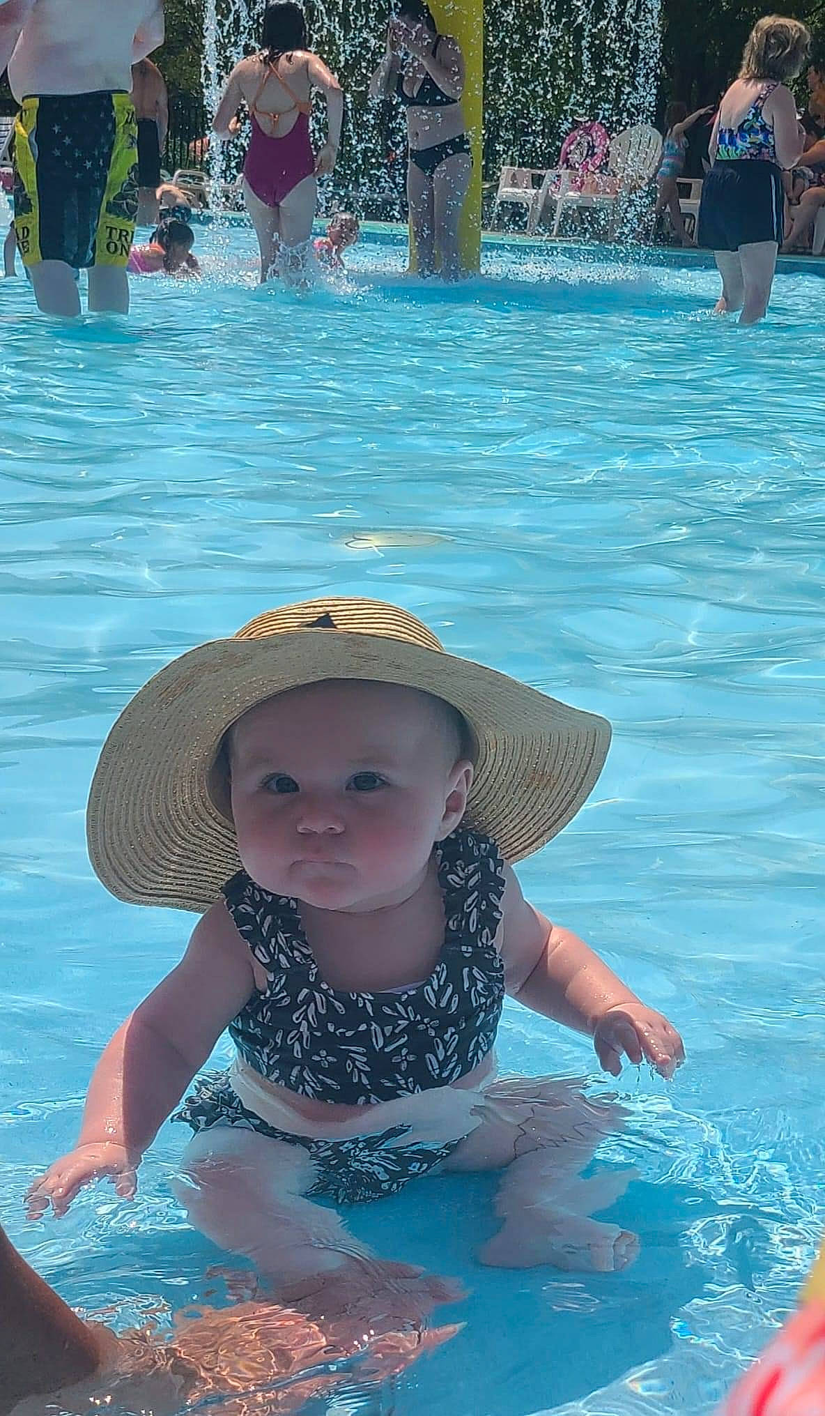 Kenleigh is registered to the contest to win money with this photo: aqua, azure, blue, cap, child, fun, hat, headgear, leisure, people, person, personal_protective_equipment, photograph, recreation, summer, sun_hat, swimming_pool, toddler, water, white