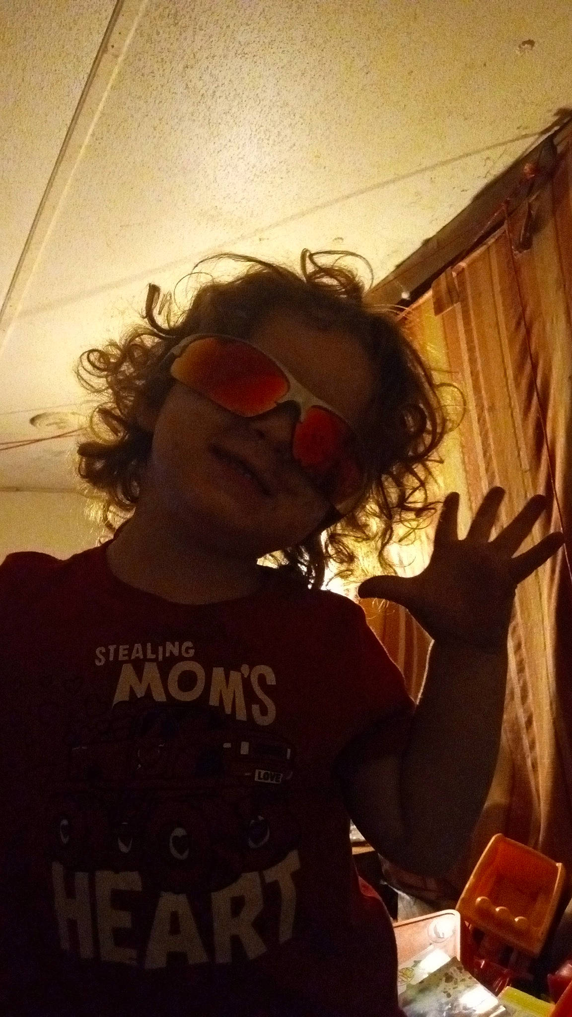 Elijah joined the competition — help win amazing prizes! audio_equipment, beard, blond, cool, curtain, eyewear, facial_hair, font, fun, gesture, goggles, hair, happy, long_hair, mouth, person, sleeve, sunglasses, t_shirt, tints_and_shades