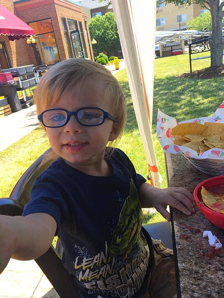 Finley is registered to the contest to win money with this photo: child, city, community, cool, eyewear, fun, glasses, grass, happy, leaf, leisure, morning, person, plant, public_space, recreation, summer, sunlight, toddler, tree