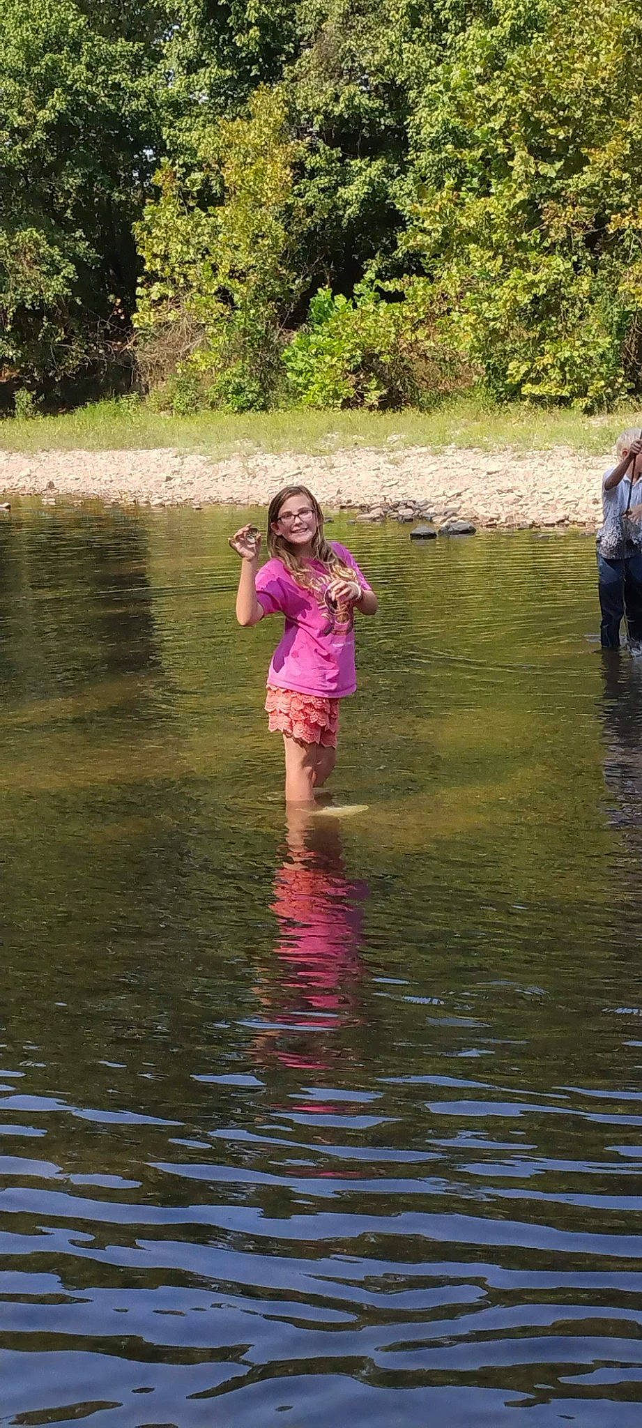 Katelyn is registered to the contest to win money with this photo: bank, fluvial_landforms_of_streams, forest, fun, grass, happy, joy, lacustrine_plain, lake, leisure, natural_landscape, nature, people_in_nature, person, plant, recreation, reservoir, stream, tree, water