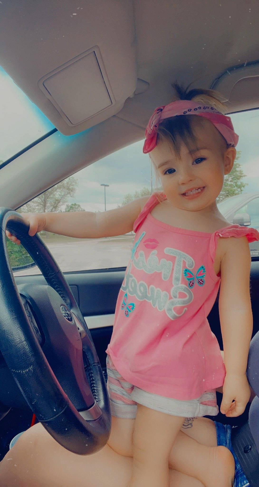 Aevary is registered to the contest to win money with this photo: auto_part, automotive_exterior, black_hair, cap, cool, fun, hairstyle, happy, joy, leg, leisure, motor_vehicle, person, shorts, shoulder, skin, smile, thigh, toddler, travel