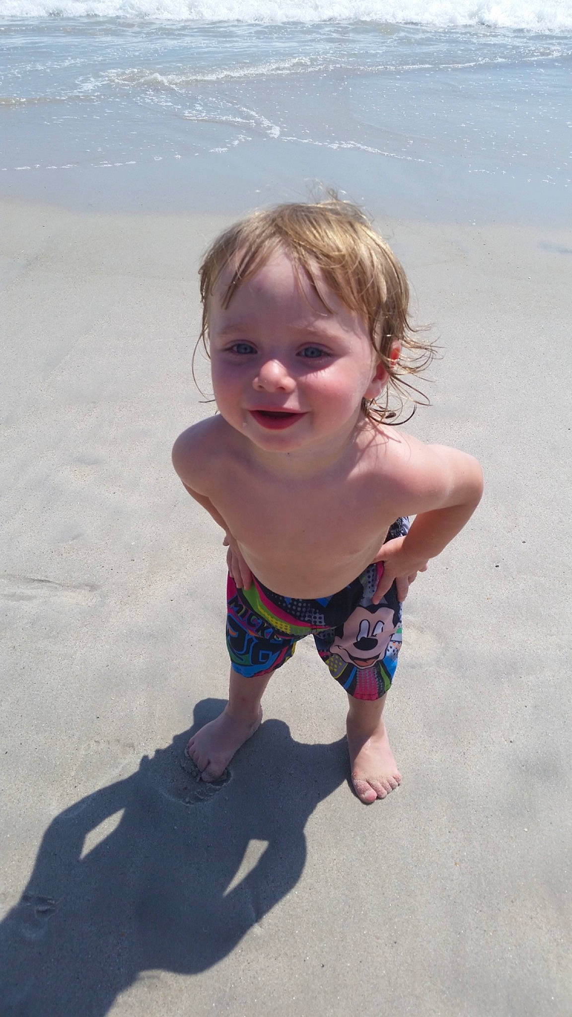 Nathaniel is registered to the contest to win money with this photo: azure, baby_toddler_clothing, barefoot, beach, beauty, eye, foot, fun, hair, happy, head, joy, leg, people, people_in_nature, person, sand, skin, smile, summer