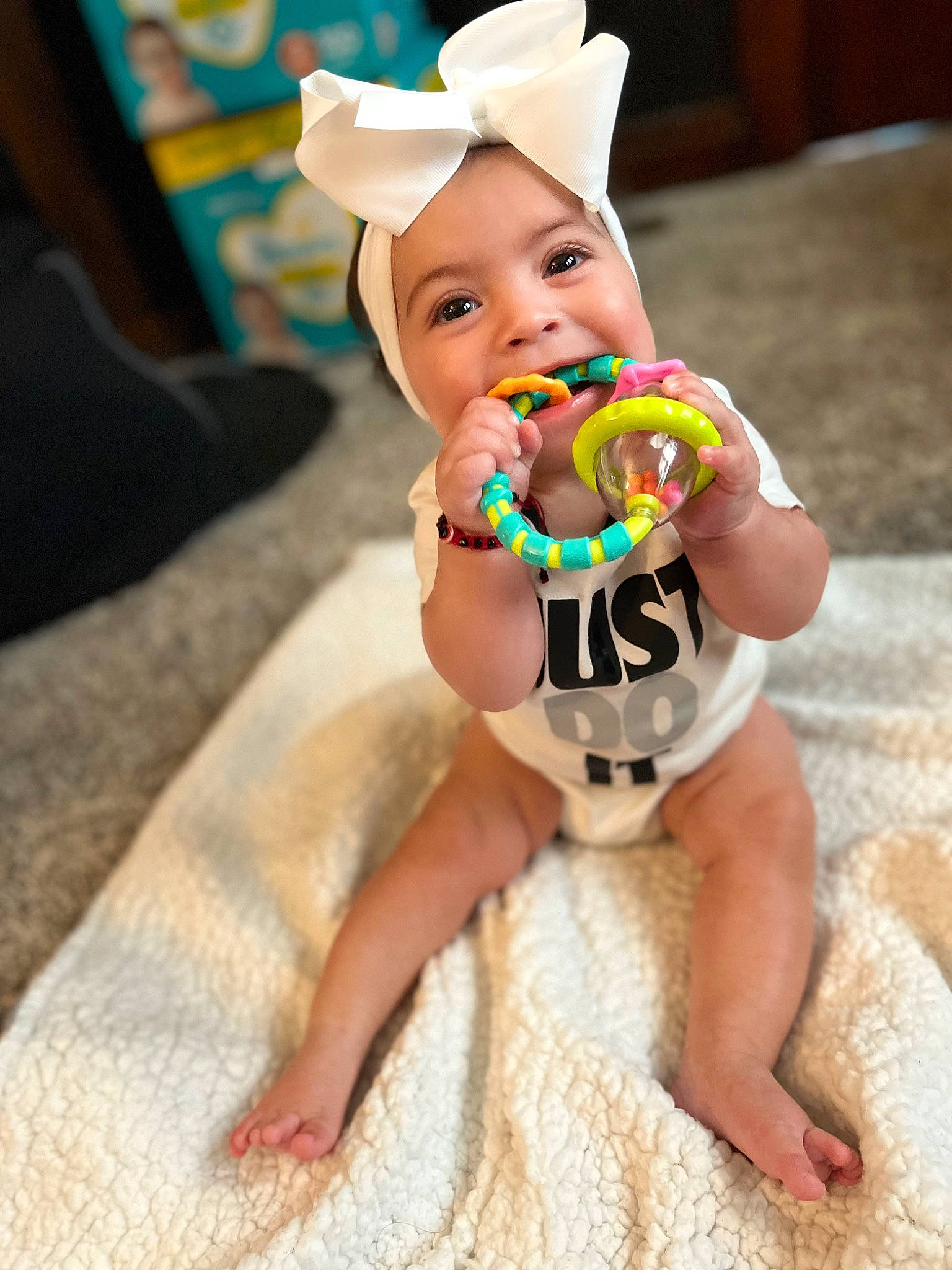 Kamila joined the competition — help win amazing prizes! baby, baby_products, baby_toddler_clothing, child, doll, fictional_character, flooring, foot, fun, happy, hat, headwear, human_leg, nail, party_supply, person, personal_protective_equipment, sitting, sweetness, toddler
