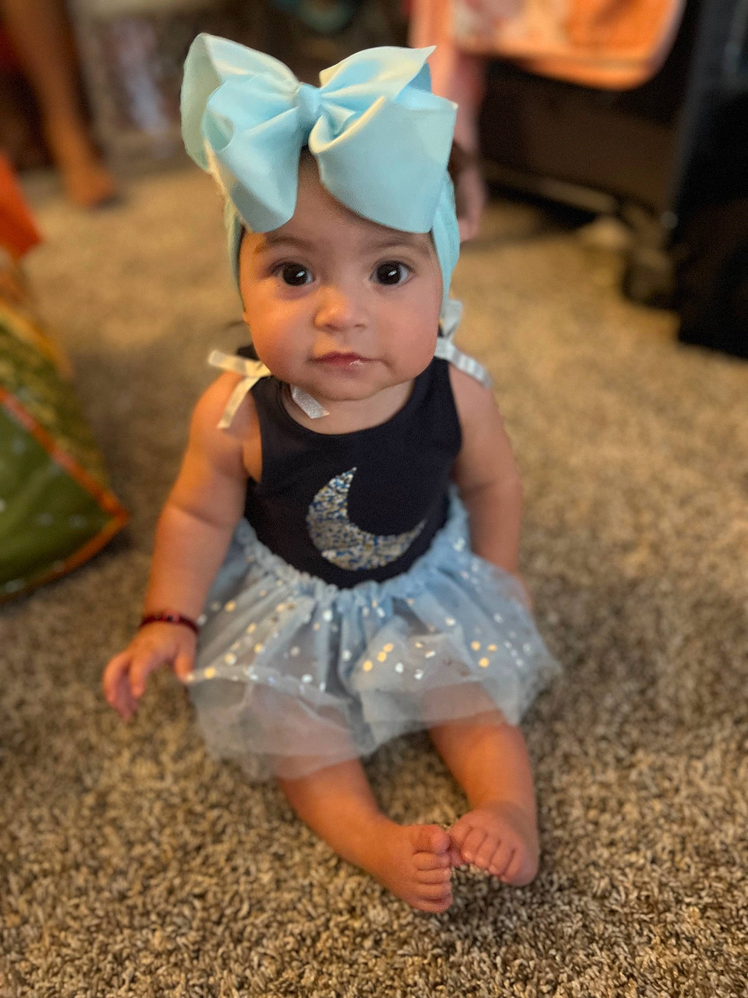 Kamila is registered to the contest to win money with this photo: baby, baby_toddler_clothing, chair, child, costume_hat, event, eye, fashion_accessory, flooring, fun, grass, happy, headband, headwear, party_supply, pattern, person, sitting, sleeve, smile