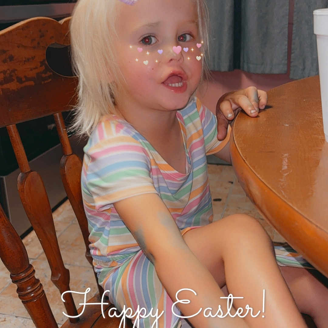 Loralie Rector joined the competition — help win amazing prizes! bunny_ears_filter, candid, casual, child, curtains, cute, easter, floor_tiles, girl, heart_freckles, indoor, kitchen, pink_headband, playful, sitting, smiling, striped_dress, table, text_overlay, wooden_chair