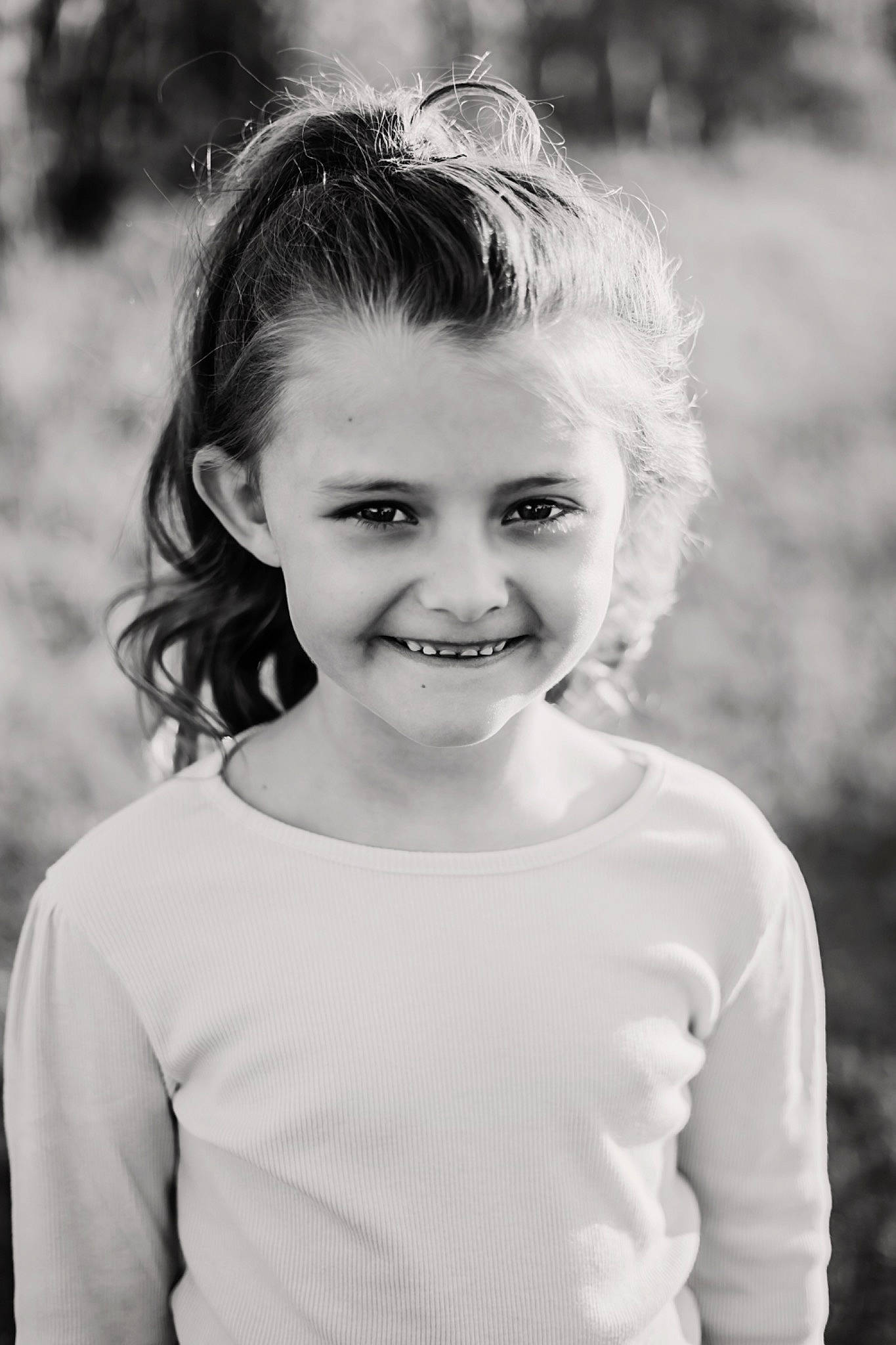 Maci is registered to the contest to win money with this photo: black, black_and_white, chin, clothing, flash_photography, grass, hair, hairstyle, happy, human_body, iris, joy, lip, people_in_nature, person, plant, shoulder, skin, sleeve, smile