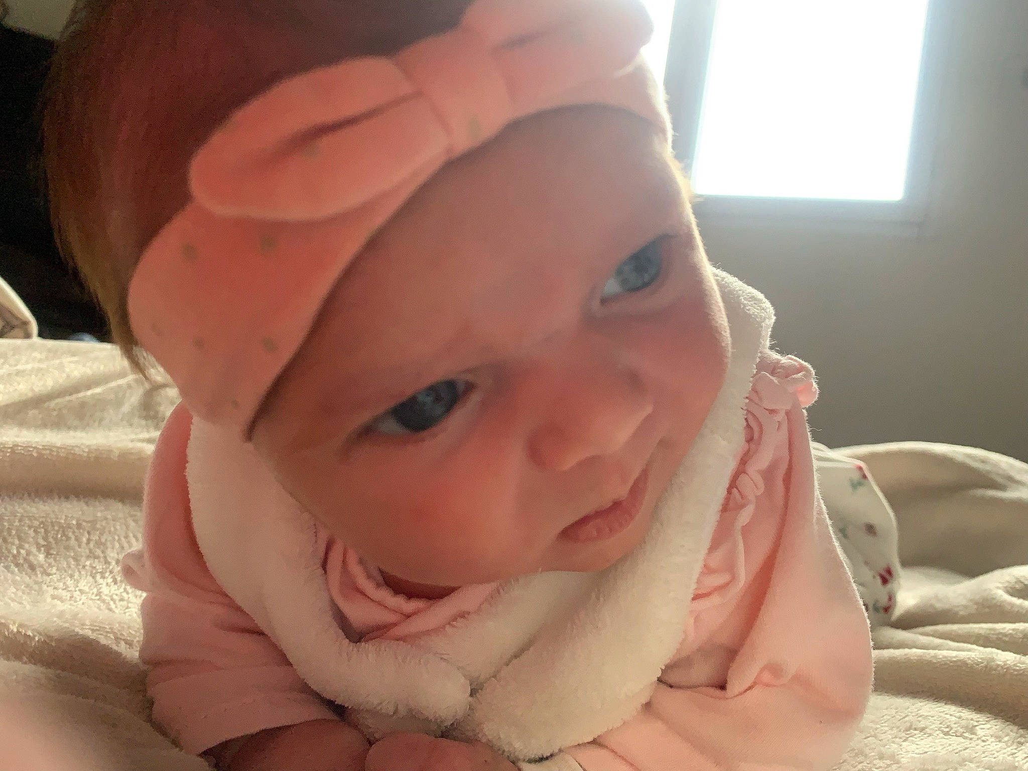 Mya participe au concours pour gagner de l'argent avec cette photo : baby, cheek, comfort, ear, eye, eyelash, finger, gesture, hand, happy, headwear, iris, lip, mouth, neck, nose, person, pink, skin, smile