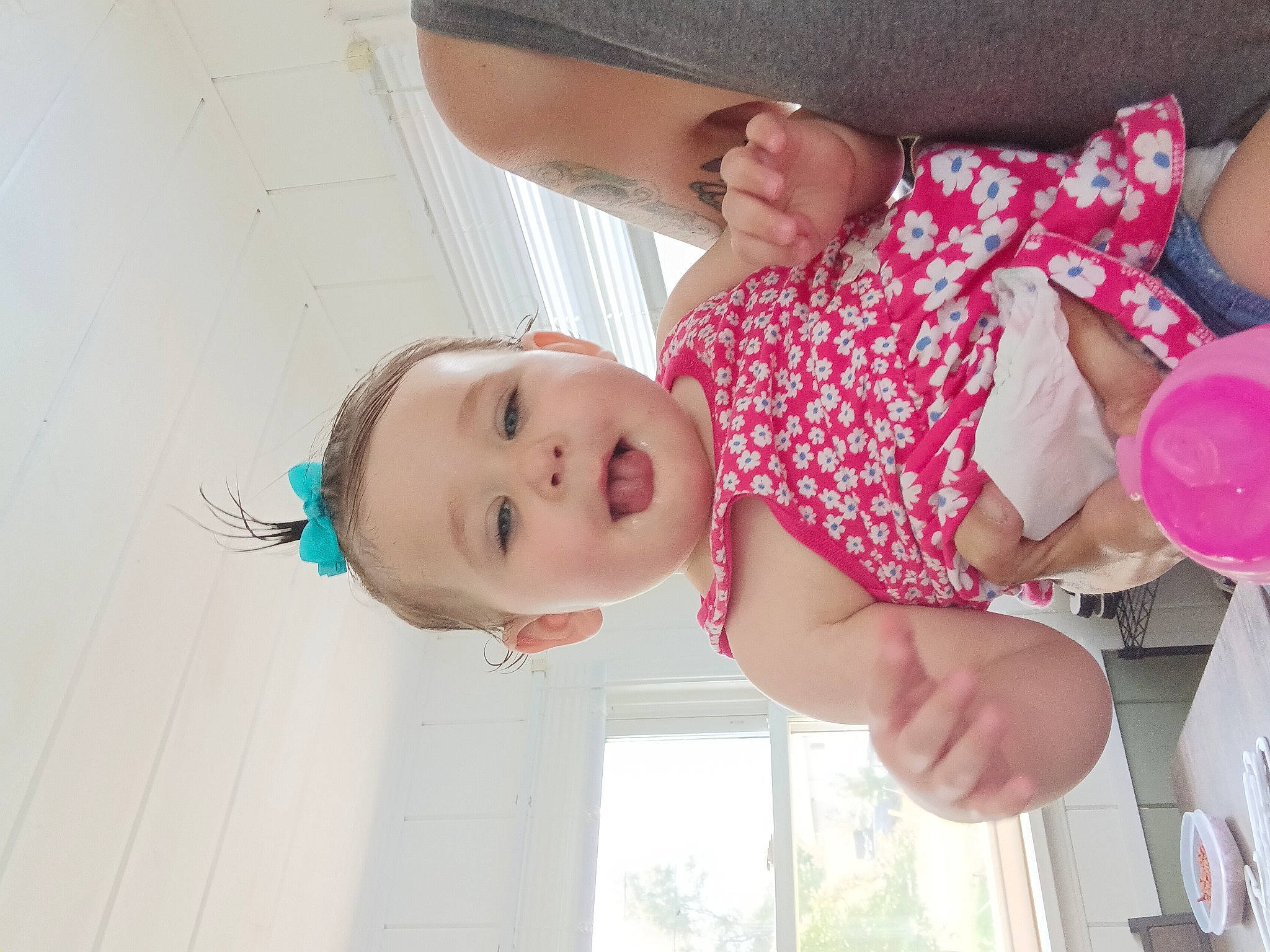 Zoey is registered to the contest to win money with this photo: baby, baby_toddler_clothing, cheek, child, fashion_accessory, finger, fun, happy, hat, nail, pattern, person, pink, skin, smile, sun_hat, thumb, toddler, white, window