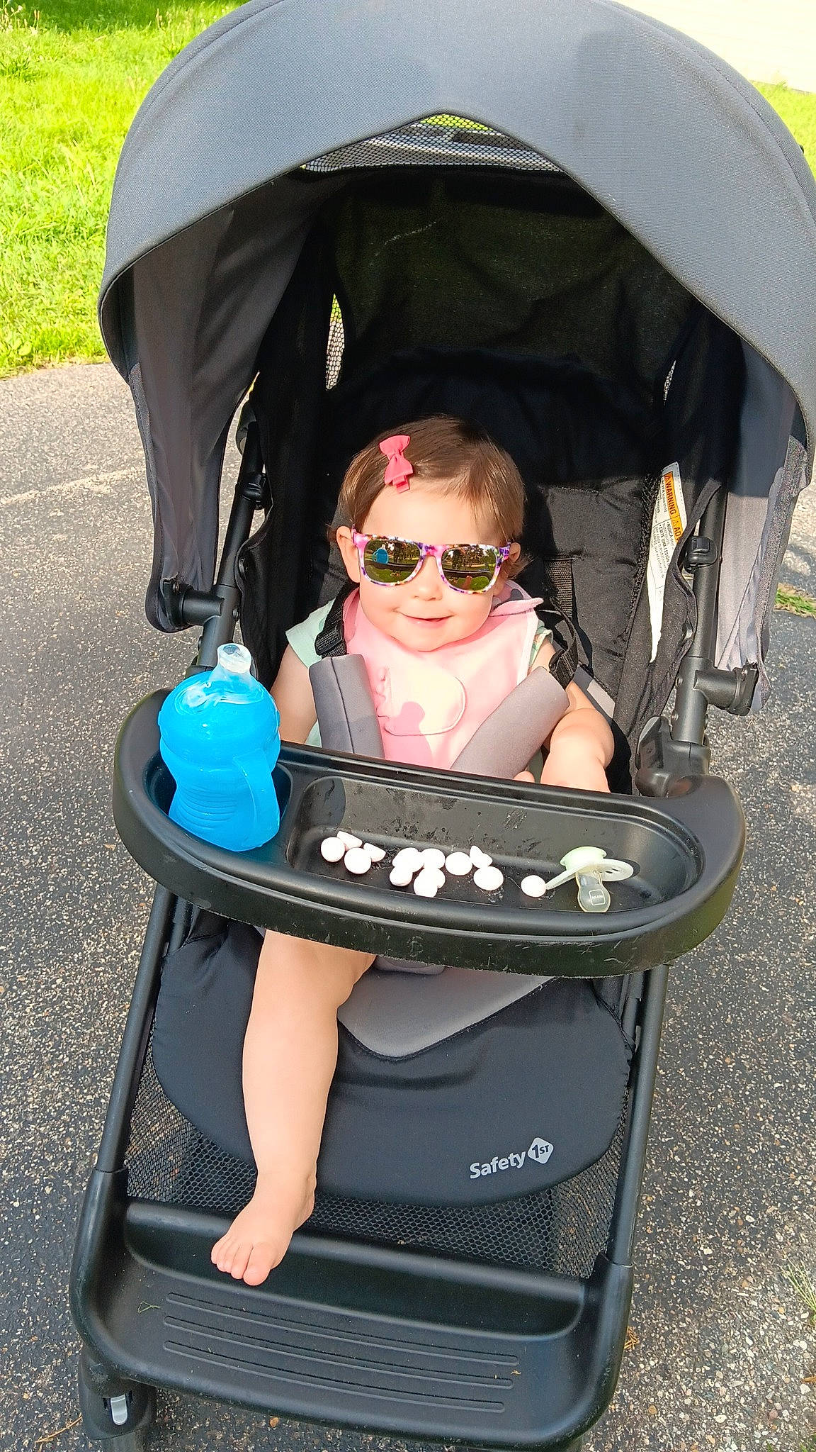 Zoey is registered to the contest to win money with this photo: baby, baby_carriage, baby_products, black, child, comfort, electric_blue, eyewear, fashion_accessory, fun, goggles, joy, person, personal_protective_equipment, photograph, product, shade, sitting, smile, sunglasses