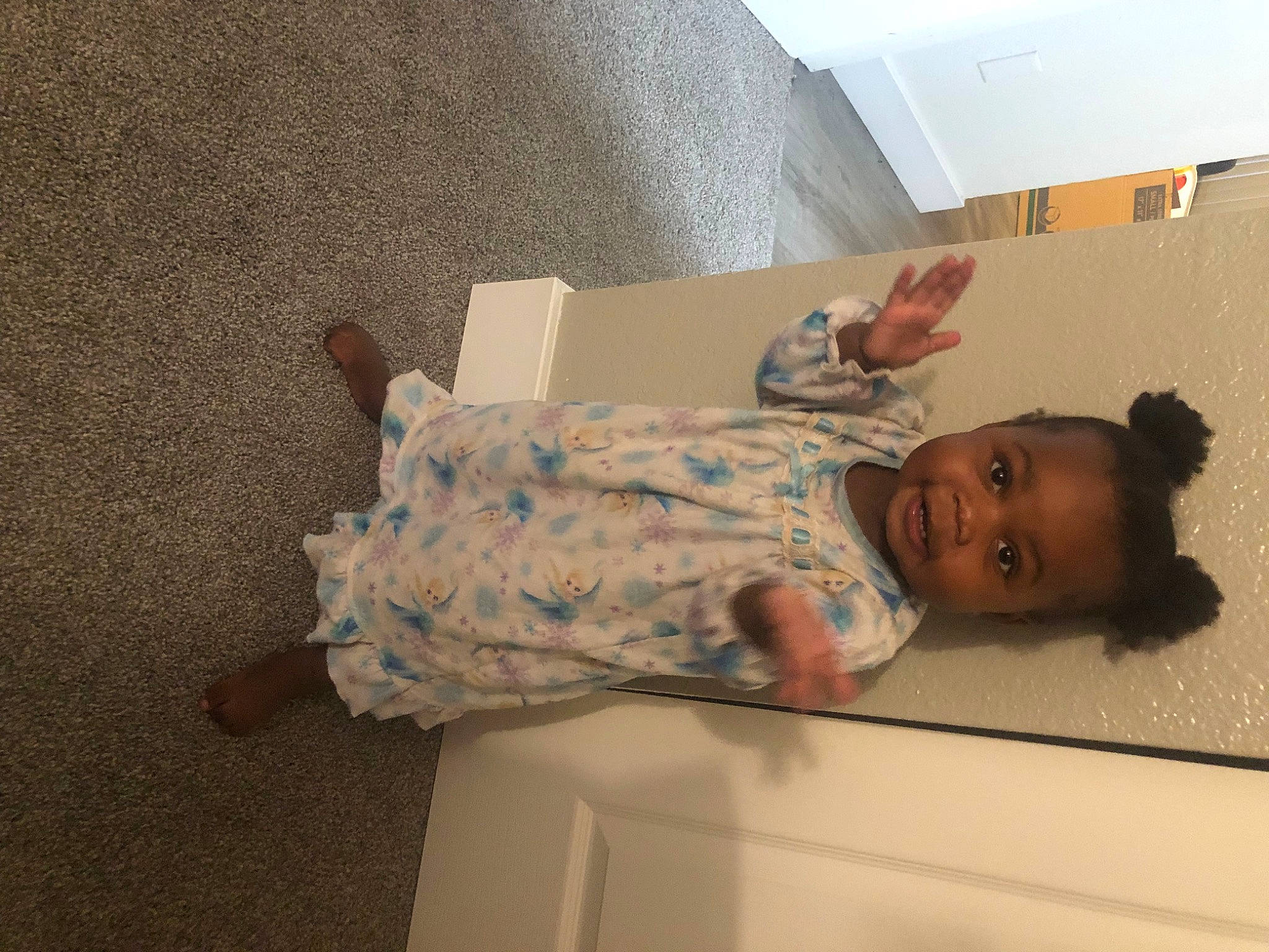 Amariyah Smith is registered to the contest to win money with this photo: baby, bathing, ceiling, comfort, floor, flooring, hardwood, laundry_room, military, military_camouflage, paper, paper_product, person, plaster, room, smile, soldier, toddler, wood
