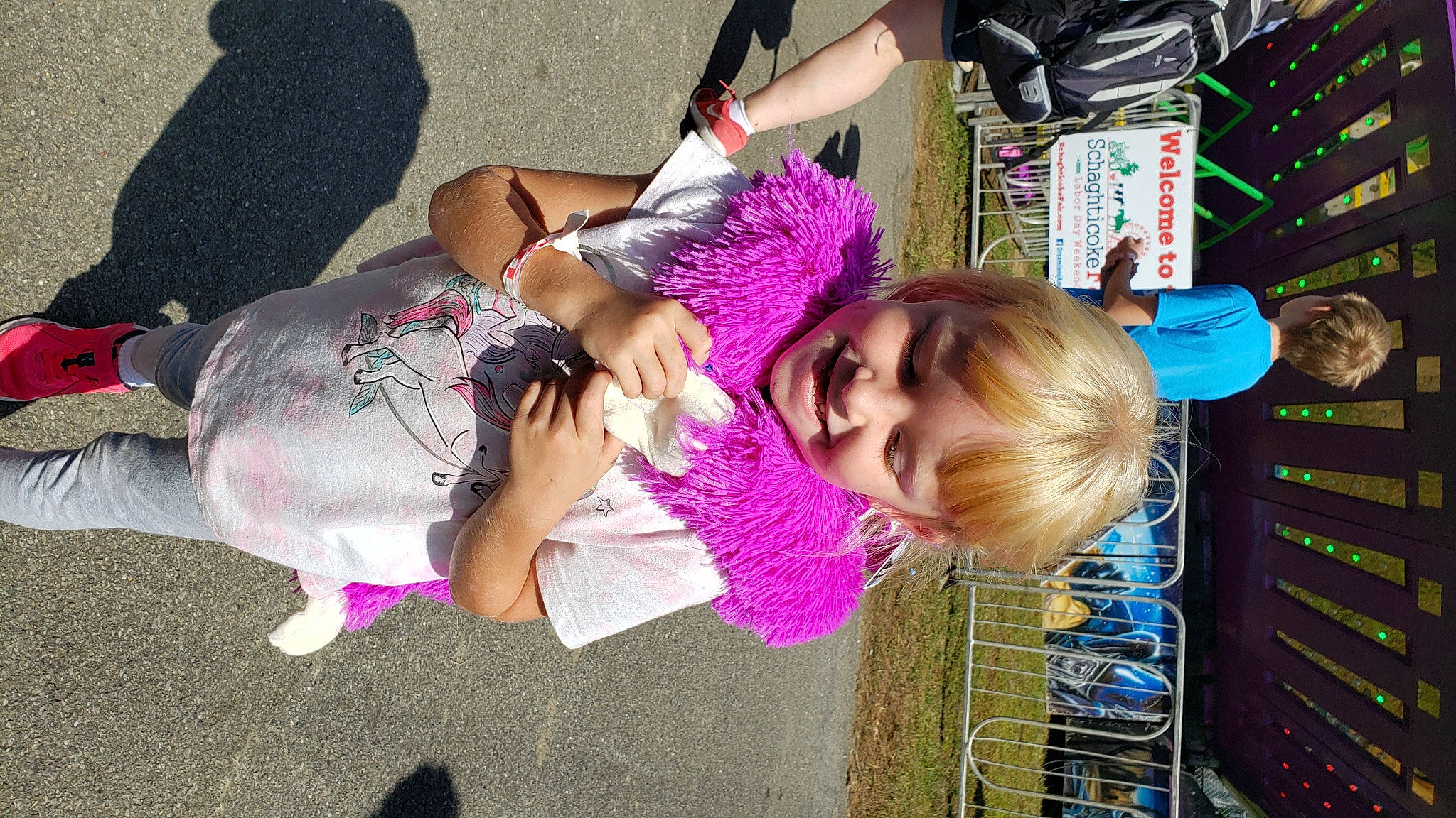 Kinzleigh is registered to the contest to win money with this photo: child, cool, fun, grass, green, happy, human_leg, joy, knee, leisure, magenta, person, pink, plant, play, purple, recreation, smile, textile, thigh