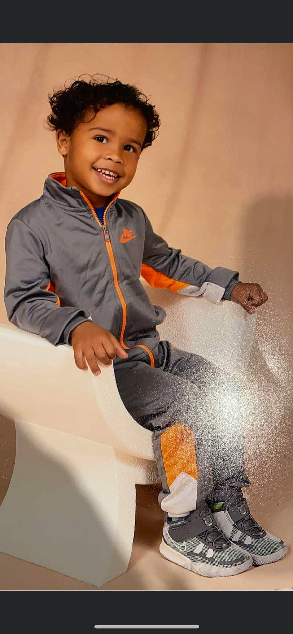 Kamden joined the competition — help win amazing prizes! chair, collar, comfort, cool, dress_shirt, facial_expression, flash_photography, flooring, formal_wear, fun, happy, human_body, human_leg, joy, knee, neck, person, skin, sleeve, smile