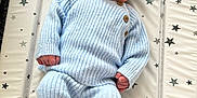Albie joined the competition — help win amazing prizes! baby, newborn, sleeping, blue_outfit, knitted_clothing, hat, infant, peaceful, star_pattern, mattress, cute, cozy, small_hands, small_feet, indoors, portrait, child, resting, soft_light, sleep