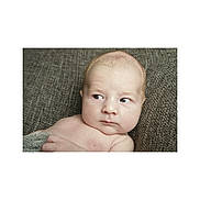 Albie joined the competition — help win amazing prizes! baby, blanket, candid, child, closeup, curious, expression, eyes, face, head, human, indoors, infant, newborn, portrait, resting, skin, soft, texture, young