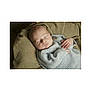 Albie joined the competition — help win amazing prizes! baby, sleeping, infant, cozy, knitted_sweater, blanket, soft_texture, peaceful, cute, resting, newborn, portrait, child, indoor, warm, hands, face, head, relaxation, comfort