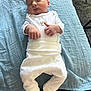 Albie joined the competition — help win amazing prizes! baby, newborn, sleeping, white_clothing, pajamas, blanket, blue_blanket, couch, infant, peaceful, resting, indoor, soft_texture, cute, small_hands, portrait, child, toddler, head, face