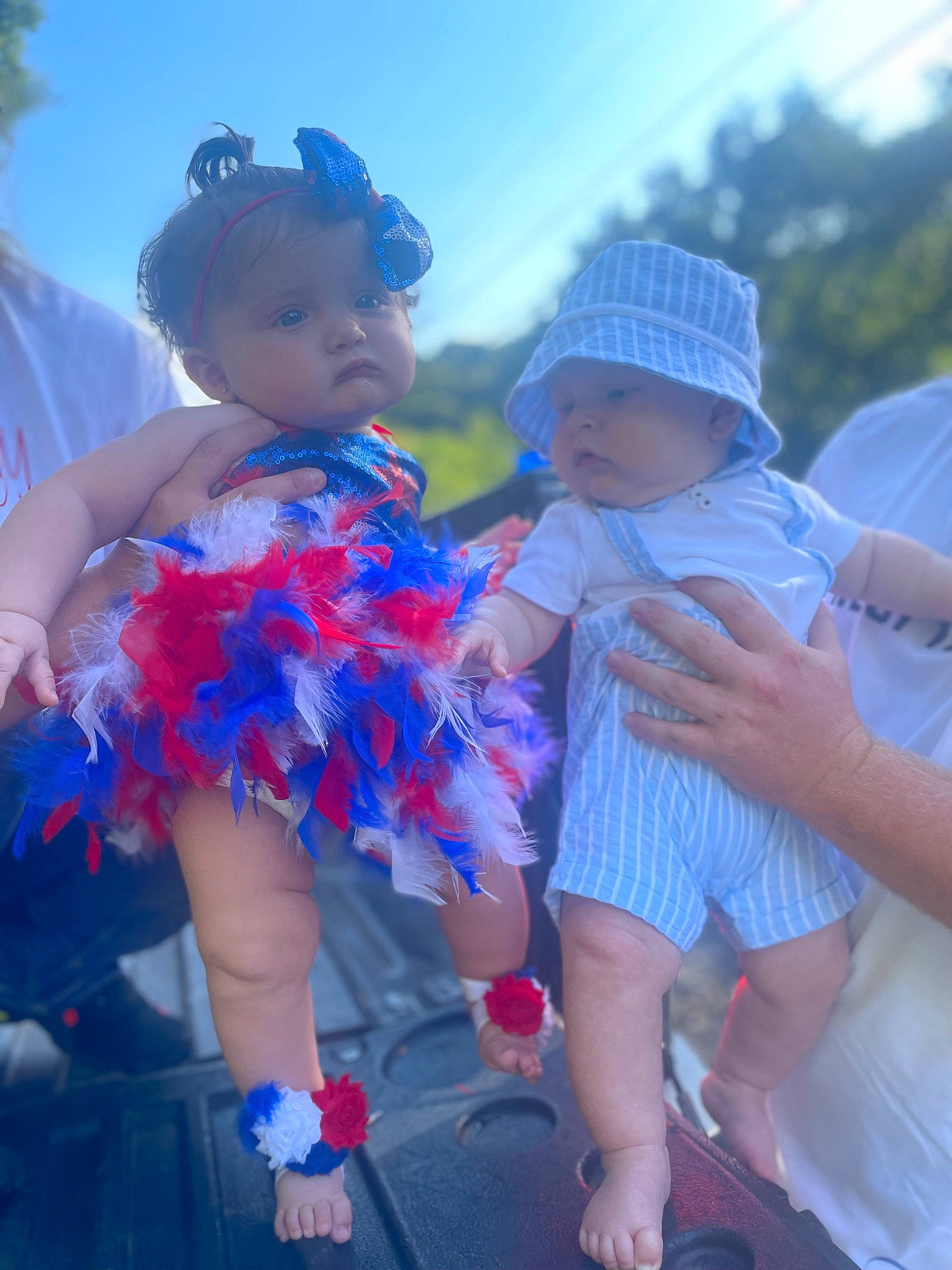 Madeline is registered to the contest to win money with this photo: azure, blue, child, electric_blue, facial_expression, fun, gesture, happy, hat, headwear, interaction, leisure, magenta, person, pink, purple, skin, sky, standing, sunlight