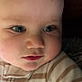 Declan is registered to the contest to win money with this photo: baby, child, face, blue_eyes, close_up, cozy, striped_outfit, infant, cute, portrait, soft_lighting, chubby_cheeks, skin, expression, young, person, apparel, childhood, indoors, head