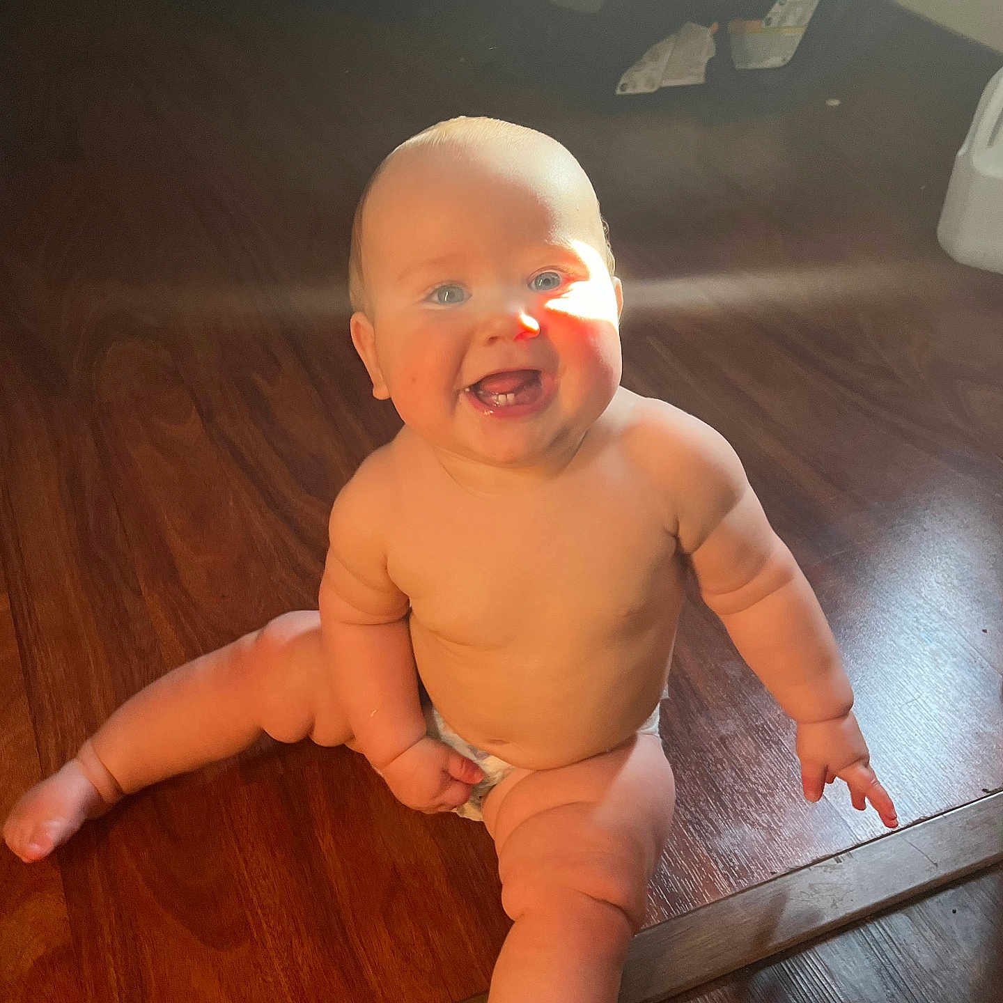 Declan joined the competition — help win amazing prizes! baby, bright, child, chubby, cute, diaper, flooring, happy, human, indoors, infant, legs, natural_light, portrait, sitting, skin, smiling, sunlight, tooth, wooden_floor