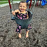 toddler, child, swing, playground, smiling, barefoot, outdoor, daylight, wood_chips, play_equipment, happy, person, clothing, summer, fun, park, joyful, baby, seat, nature