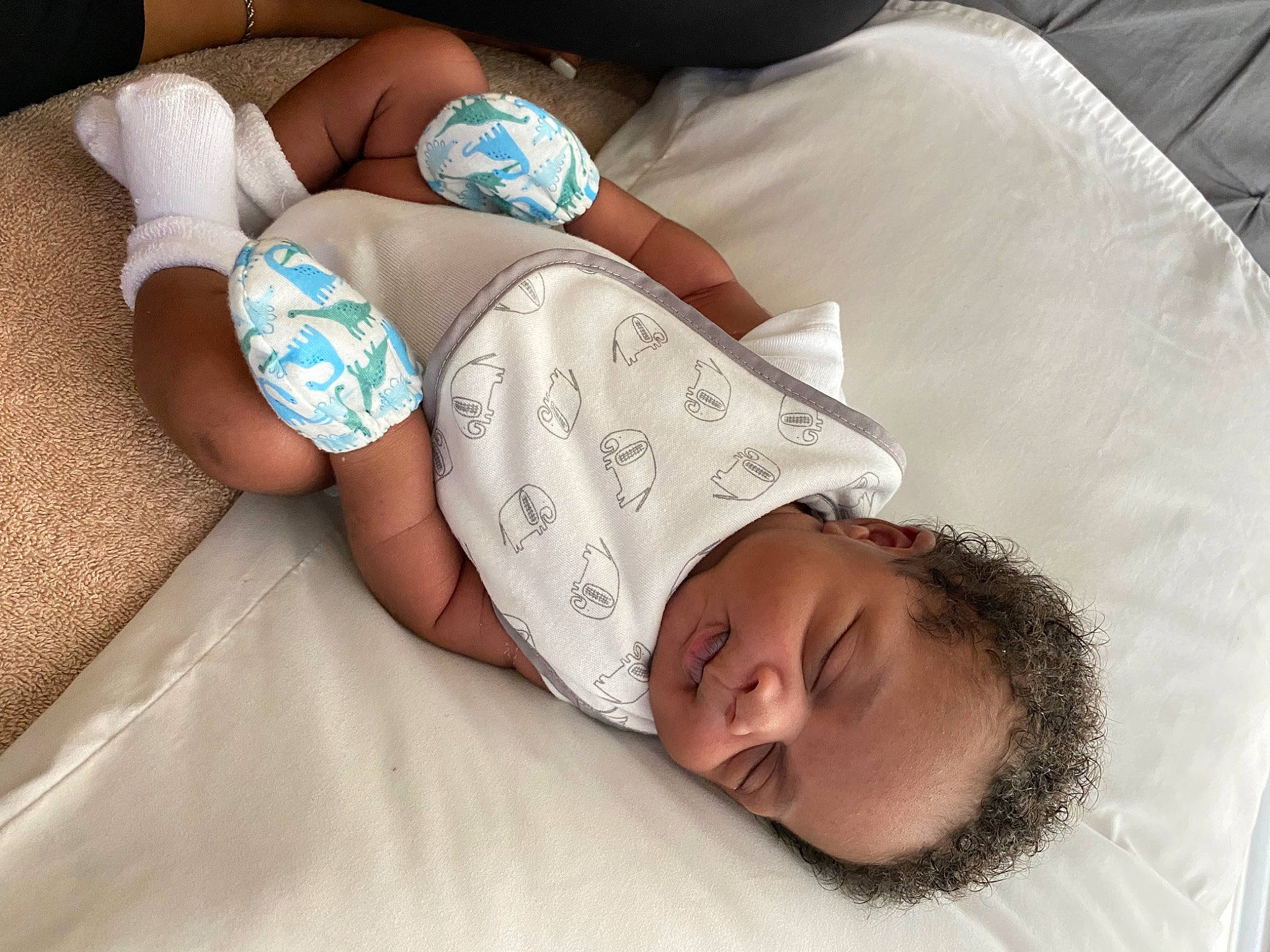 Kaidyn is registered to the contest to win money with this photo: baby, baby_sleeping, baby_toddler_clothing, bedding, bedtime, child, comfort, couch, fashion_accessory, finger, foot, hand, human_body, human_leg, leg, linens, pattern, person, textile, thigh