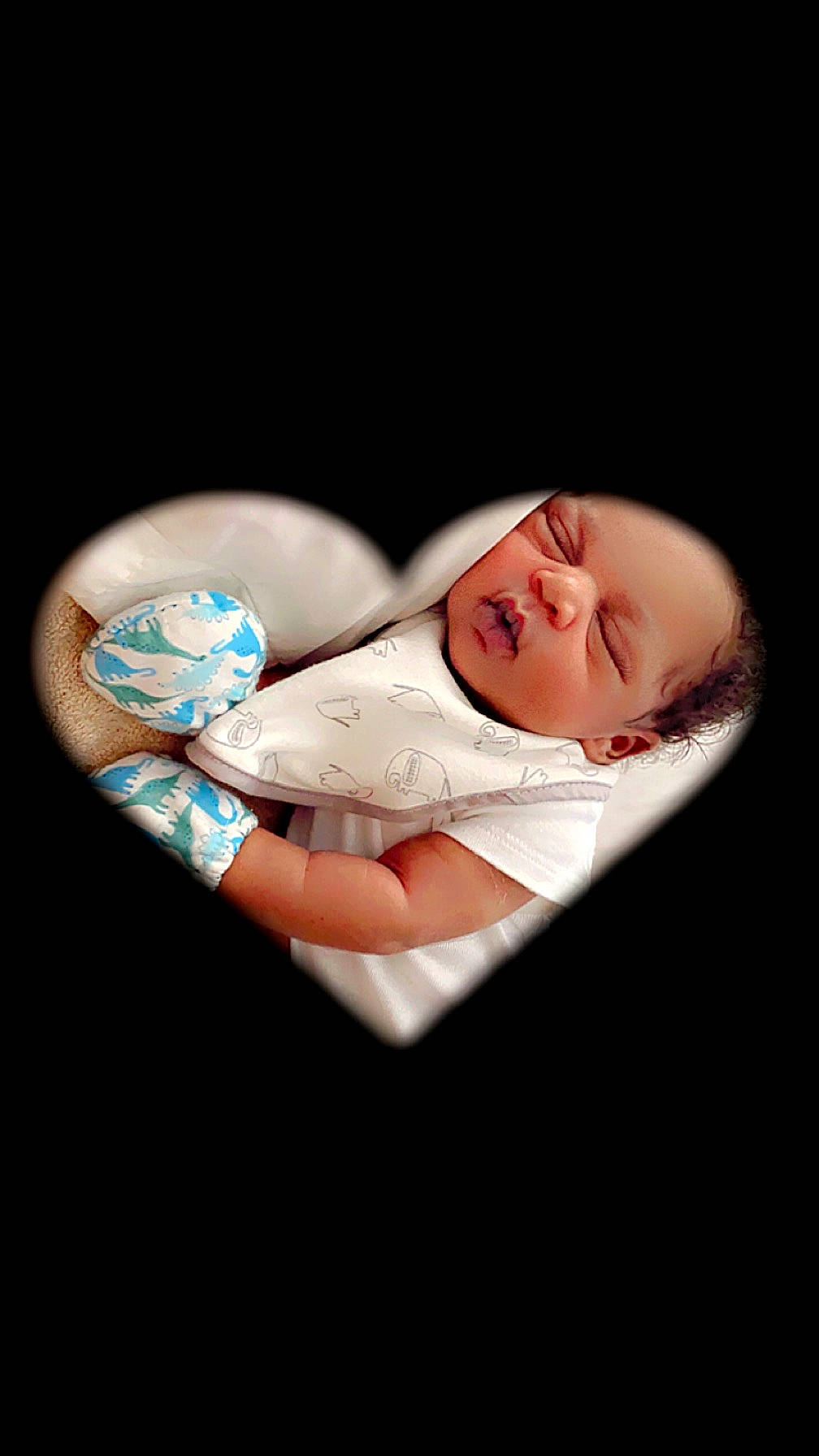 Kaidyn is registered to the contest to win money with this photo: baby, baby_products, baby_toddler_clothing, child, comfort, darkness, electric_blue, fashion_accessory, finger, flash_photography, gesture, happy, linens, person, portrait_photography, sitting, still_life_photography, toddler