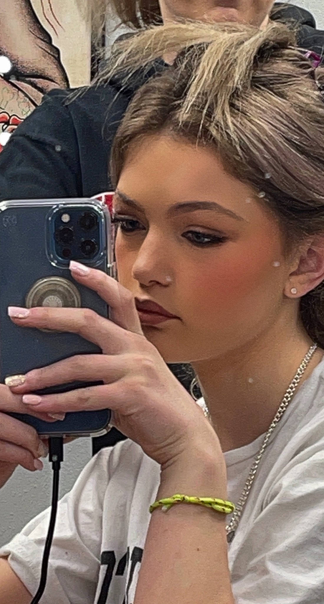 Skylar is registered to the contest to win money with this photo: audio_equipment, black_hair, chin, cool, cosmetics, earrings, eye_liner, eyebrow, eyelash, eyewear, fashion, hair, lip, long_hair, makeover, mobile_phone, neck, organ, person, photographer