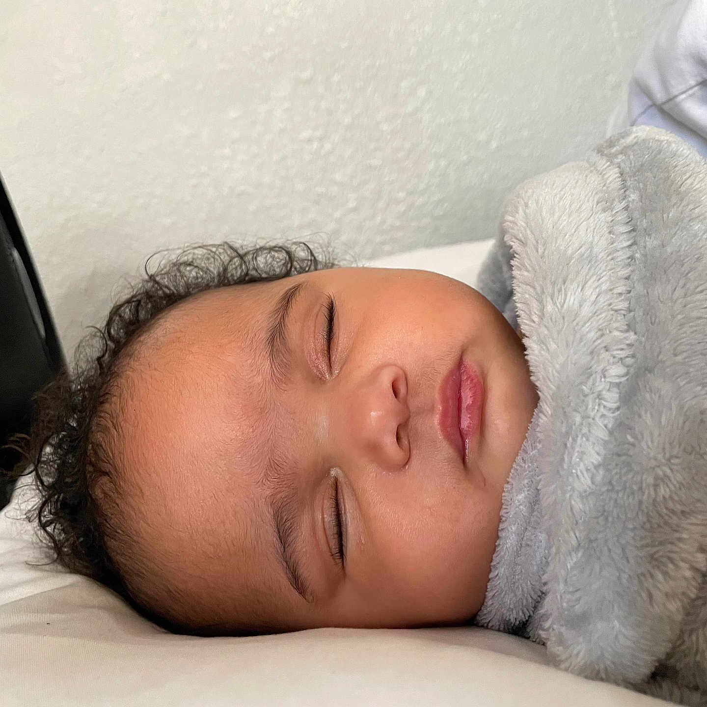 Ava joined the competition — help win amazing prizes! baby, sleeping, blanket, curly_hair, pillow, face, peaceful, resting, indoor, child, soft_texture, cozy, infant, portrait, closeup, head, human, young, peace, quiet