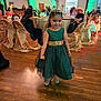 Frankie is registered to the contest to win money with this photo: child, girl, princess, tiara, dress, party, celebration, event, people, indoor, wooden_floor, chairs, table, lighting, smile, formal_wear, guests, decor, golden_chairs, happy