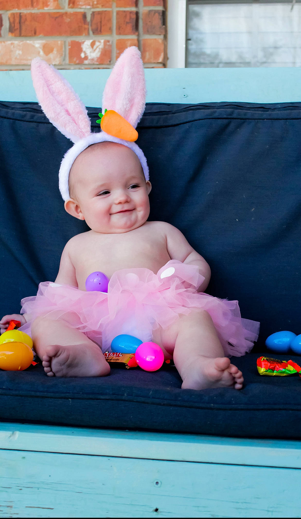 Delilah is registered to the contest to win money with this photo: baby, baby_playing_with_toys, baby_products, baby_toddler_clothing, child, comfort, event, face, fun, happy, hat, joy, magenta, person, pink, play, purple, sitting, skin, smile