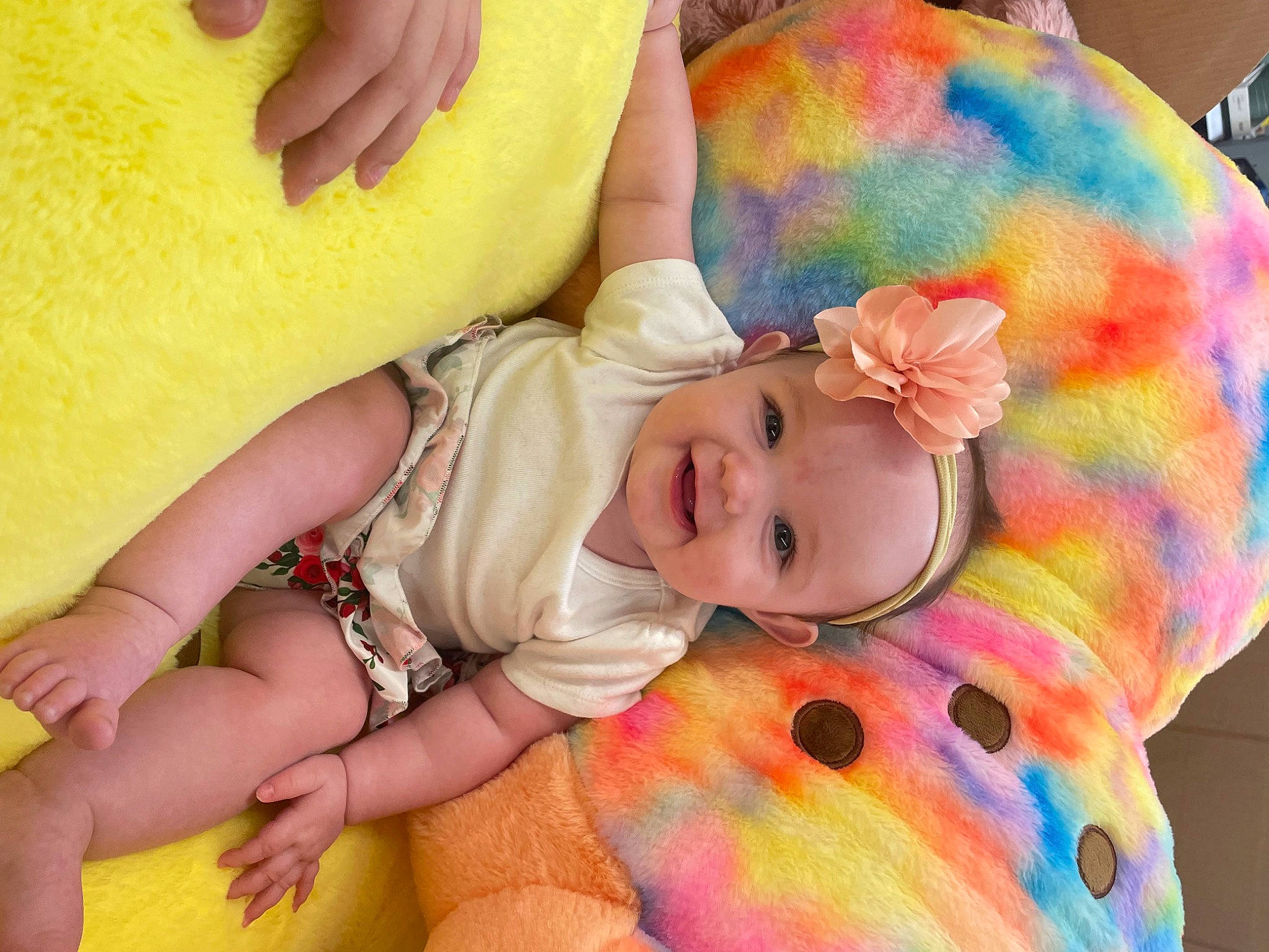 Delilah is registered to the contest to win money with this photo: baby, baby_toddler_clothing, cheek, child, comfort, eye, face, finger, fun, happy, head, headwear, iris, joy, nail, nose, orange, person, pink, skin