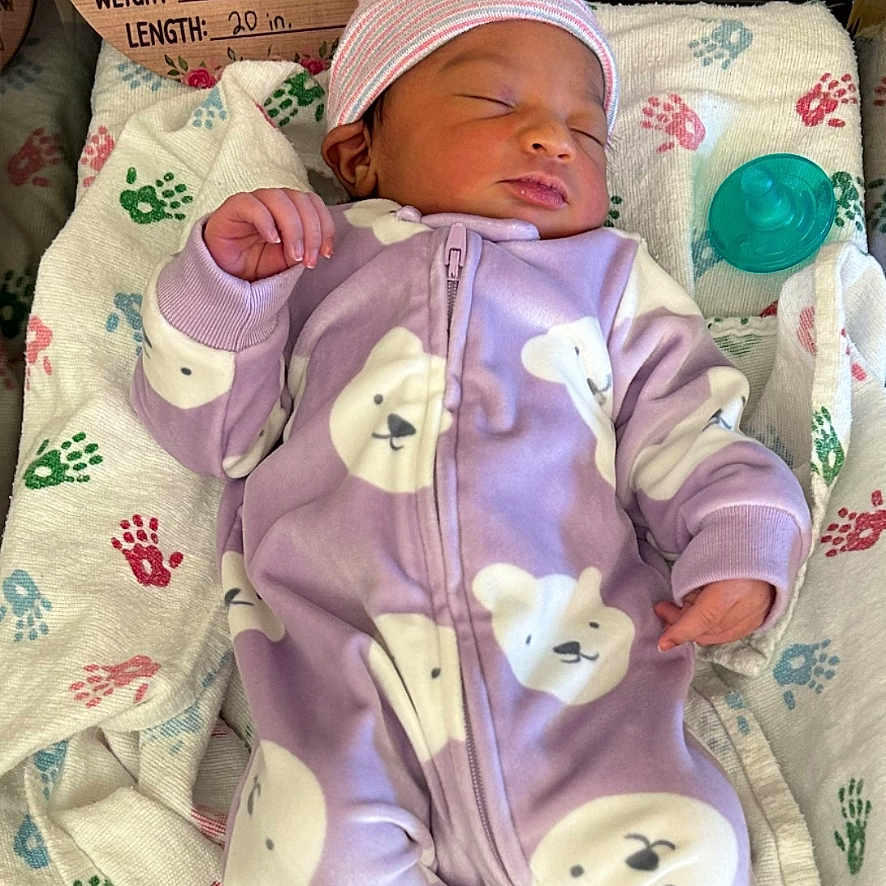 Icelee is registered to the contest to win money with this photo: baby, babycare, bassinet, bear_pattern, birth_announcement, blanket, child, cute, handprint, hat, hospital, indoor, infant, newborn, onesie, peaceful, portrait, purple, sleeping, swaddled