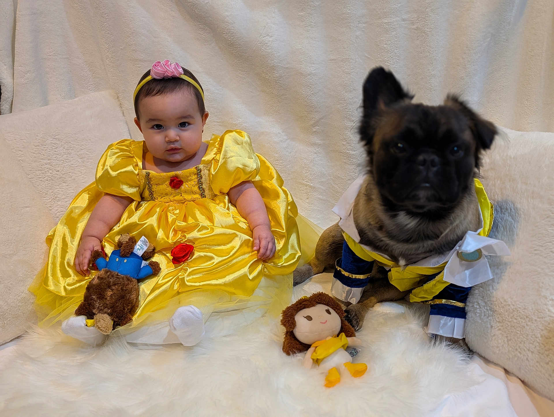 Elianna joined the competition — help win amazing prizes! baby, child, dog, costume, yellow_dress, stuffed_toy, plush_toy, headband, couch, pillow, fur, animal, pet, portrait, indoor, cute, sitting, face, smile, dress