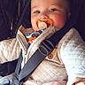émilio participe au concours pour gagner de l'argent avec cette photo : baby, baby_boy, car_seat, child, closeup, clothing, comfort, cute, face, hand, indoor, infant, pacifier, person, portrait, quilted_jacket, safety, seatbelt, smile, young_child