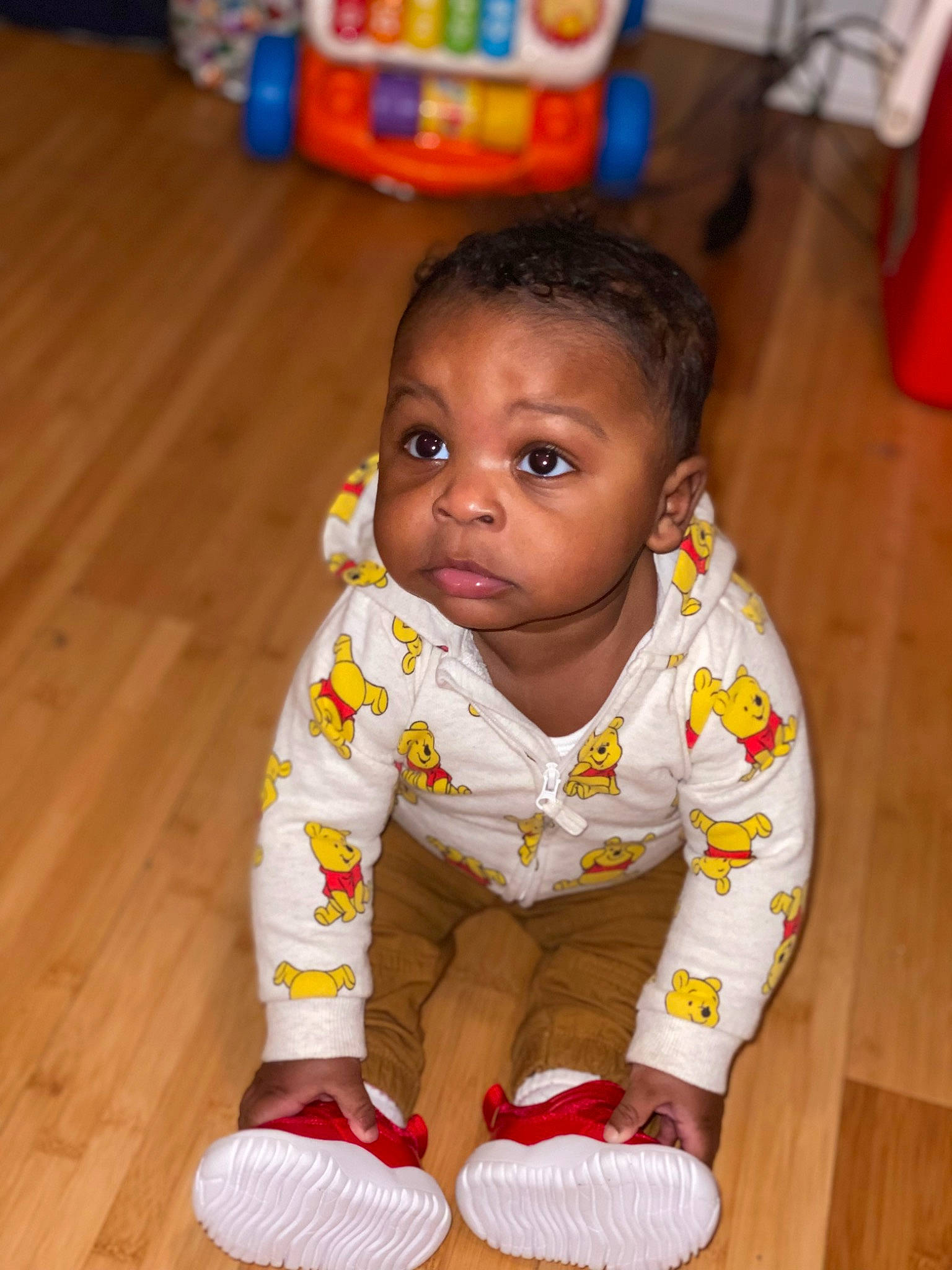 Damari joined the competition — help win amazing prizes! baby, baby_toddler_clothing, cheek, child, crawling, floor, flooring, fun, happy, hardwood, head, nose, person, sitting, skin, sleeve, smile, toddler, varnish, wood