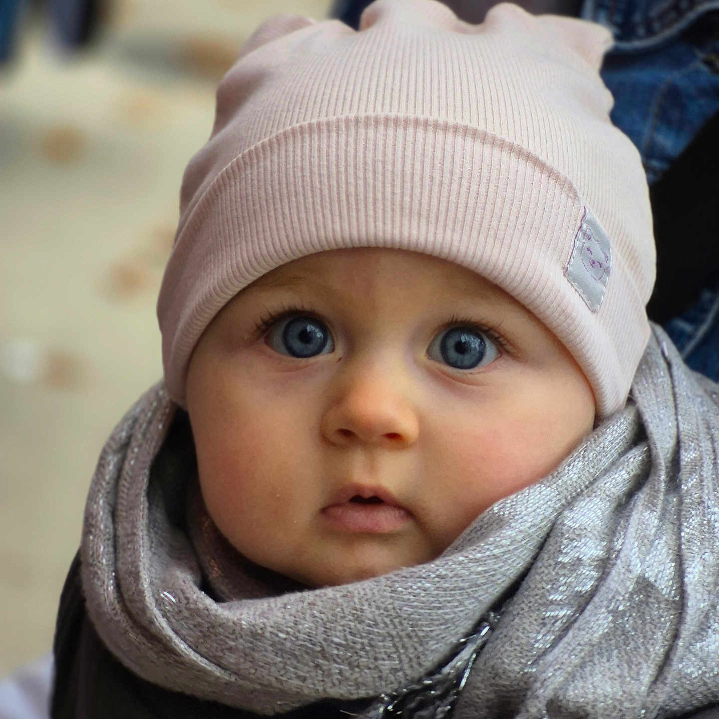 Deborah-Ema participe au concours pour gagner de l'argent avec cette photo : apparel, baby, beanie, blue_eyes, child, close_up, cute, expression, face, headwear, infant, outdoor, person, portrait, scarf, skin, soft_light, warm, winter_clothing, young_child