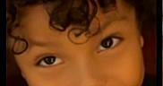 Sir Messiah joined the competition — help win amazing prizes! black_clothing, child, childhood, closeup, curly_hair, cute, dark_background, expression, eyes, face, hair, happy, head, innocence, person, portrait, skin, smiling, teeth, young